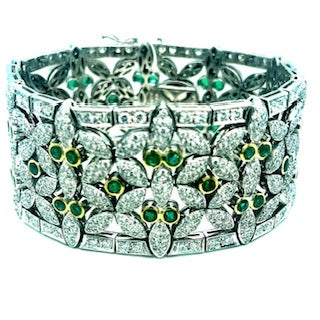 18 kt white gold bracelet with emeralds and diamonds. Call for price.