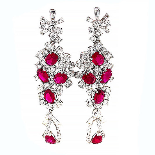 Platinum dangling earrings with no heat Ruby’s and diamonds. Call for price.