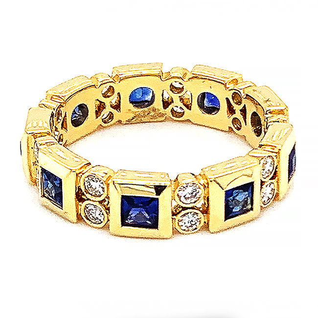 18 kt yellow gold eternity band with sapphire and diamonds