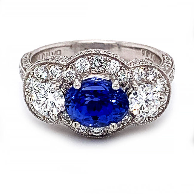 Platinum engagement ring with oval no heat natural sapphire and diamonds