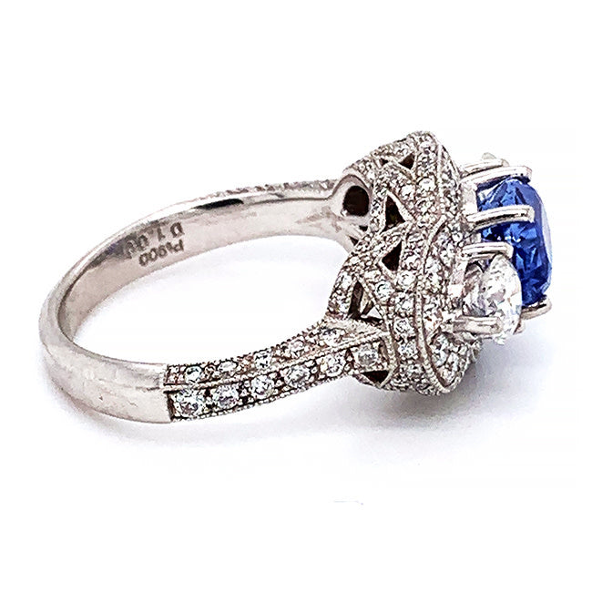 Platinum engagement ring with oval no heat natural sapphire and diamonds