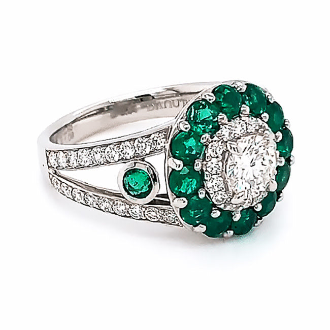 Platinum engagement ring with diamonds and emeralds