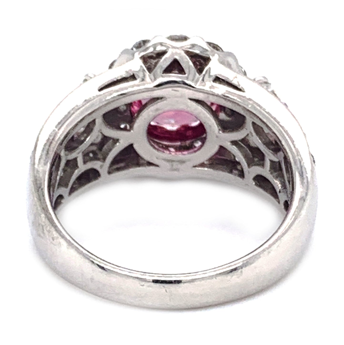 Platinum engagement ring with pink sapphire center and diamonds
