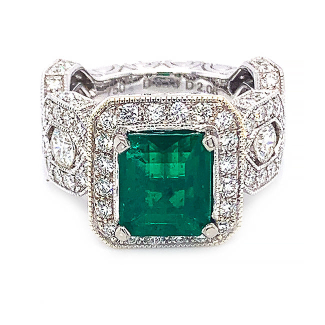 Platinum engagement ring with Colombian emerald and diamonds