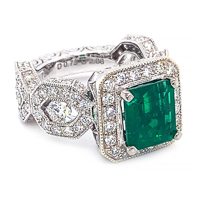 Platinum engagement ring with Colombian emerald and diamonds